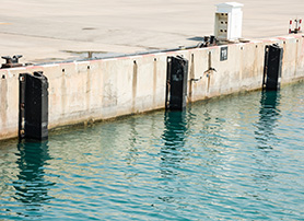 Marine rubber fenders installed on a jetty for vessel berthing protection